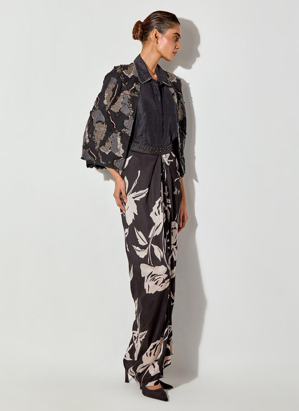Black Silk Shirt And Fully Embroiderd Organza Gilet Paired With Draped Maxi Skirt With Embroidered Detailing On Waist