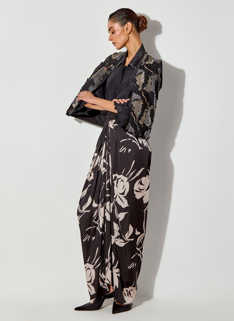 Black Silk Shirt And Fully Embroiderd Organza Gilet Paired With Draped Maxi Skirt With Embroidered Detailing On Waist