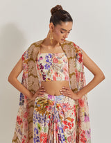 Blooming Burst Satin Cowl Skirt Paired With Stretch Bustier And Georgette Cape With Lace Border