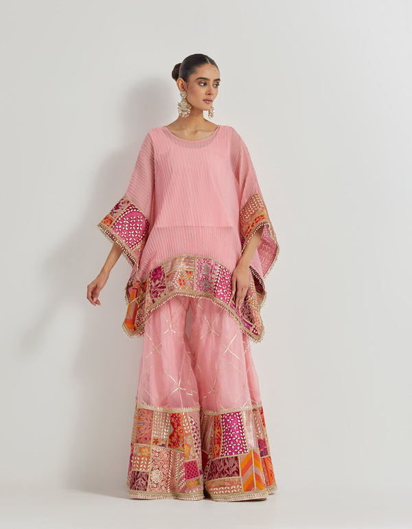 Salmon Pink Crinkle Georgette Poncho Top Paired With Organza Patch Work Sharara Pants