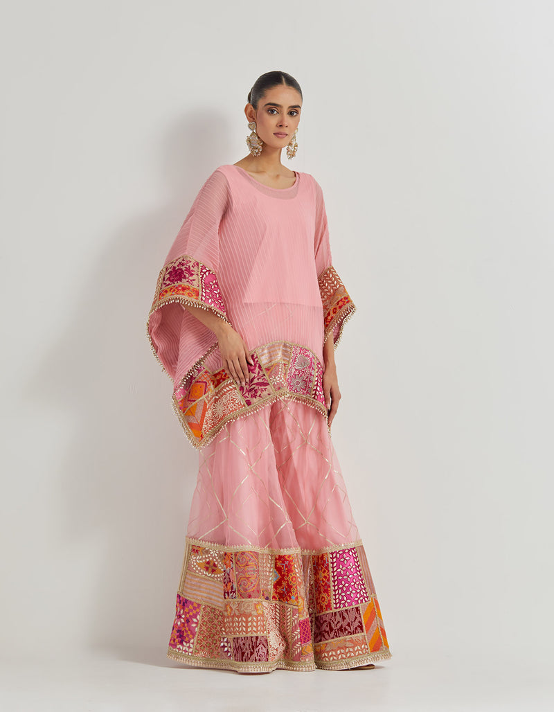 Salmon Pink Crinkle Georgette Poncho Top Paired With Organza Patch Work Sharara Pants