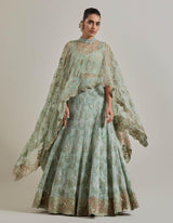 Sage Green Organza Water Glimmer Asymetric Cape Paired With Chanderi Silk Embelellished Skirt And Textured Inner