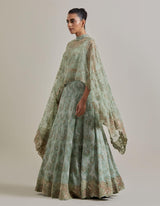 Sage Green Organza Water Glimmer Asymetric Cape Paired With Chanderi Silk Embelellished Skirt And Textured Inner