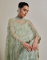 Sage Green Organza Water Glimmer Asymetric Cape Paired With Chanderi Silk Embelellished Skirt And Textured Inner
