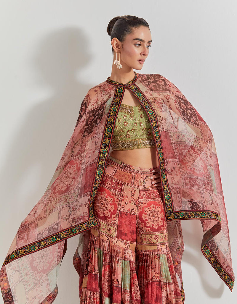 Spicy Glam Sharara Paired With Hand Embellished Bustier And Organza Cape
