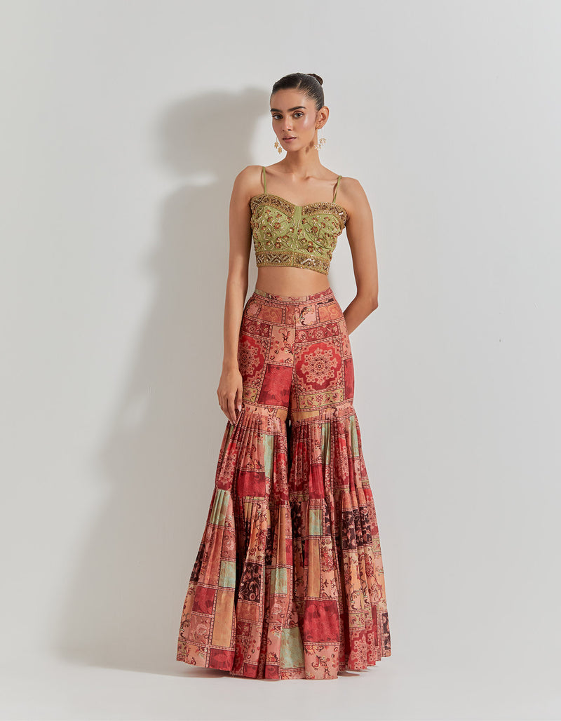Spicy Glam Sharara Paired With Hand Embellished Bustier And Organza Cape