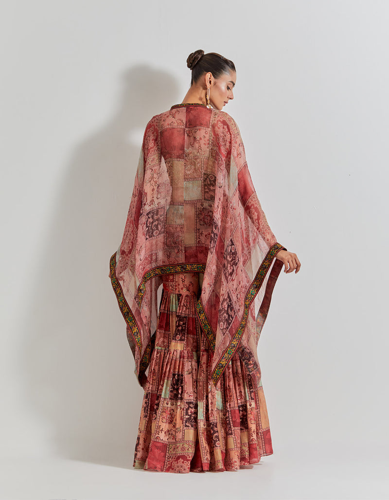 Spicy Glam Sharara Paired With Hand Embellished Bustier And Organza Cape