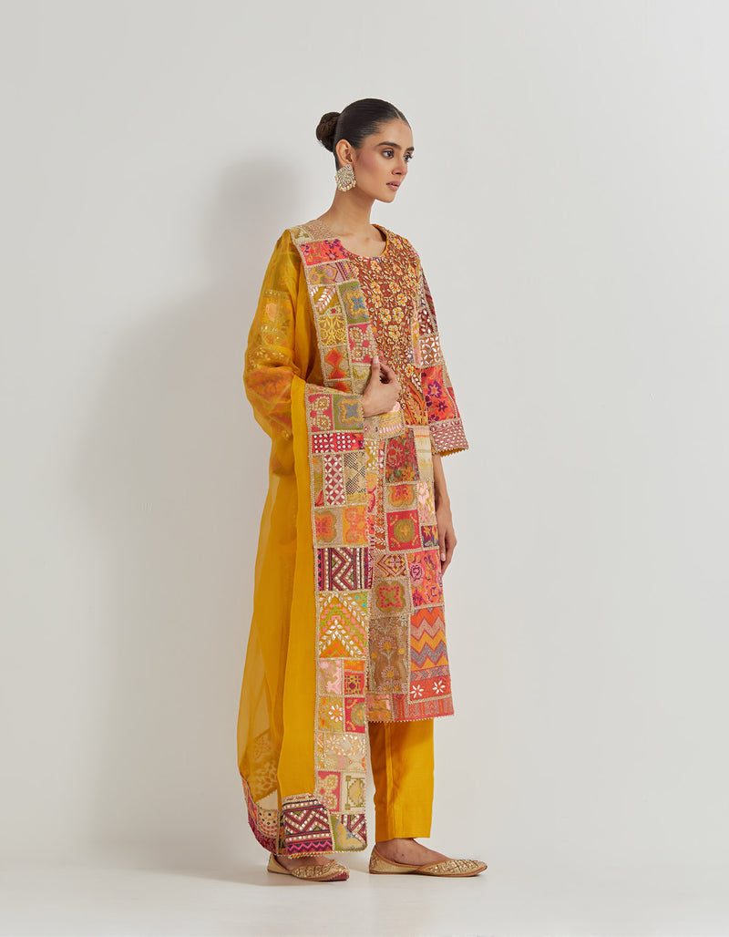 Cross Stitch Patch Work Embroidered Aline Kurta With Hand Embellished Neckline Paired With Chanderi Pants And Organza Dupatta