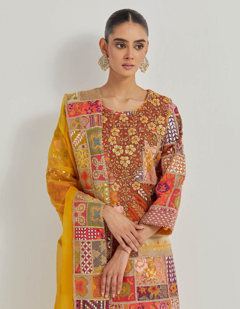 Cross Stitch Patch Work Embroidered Aline Kurta With Hand Embellished Neckline Paired With Chanderi Pants And Organza Dupatta