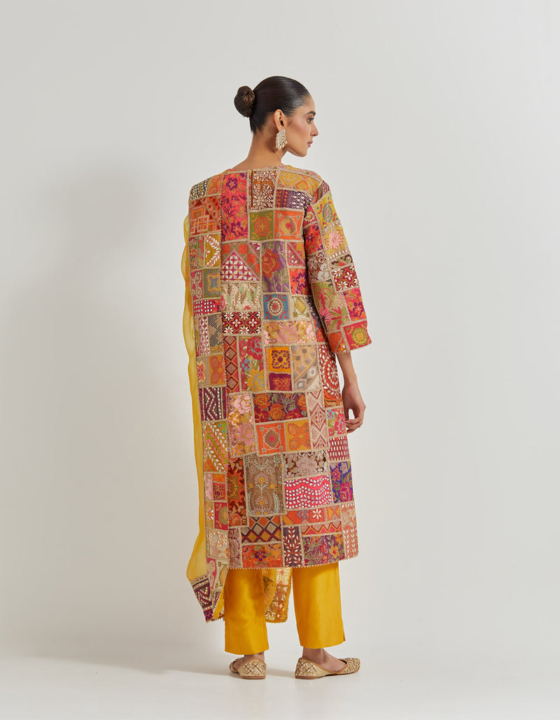 Cross Stitch Patch Work Embroidered Aline Kurta With Hand Embellished Neckline Paired With Chanderi Pants And Organza Dupatta