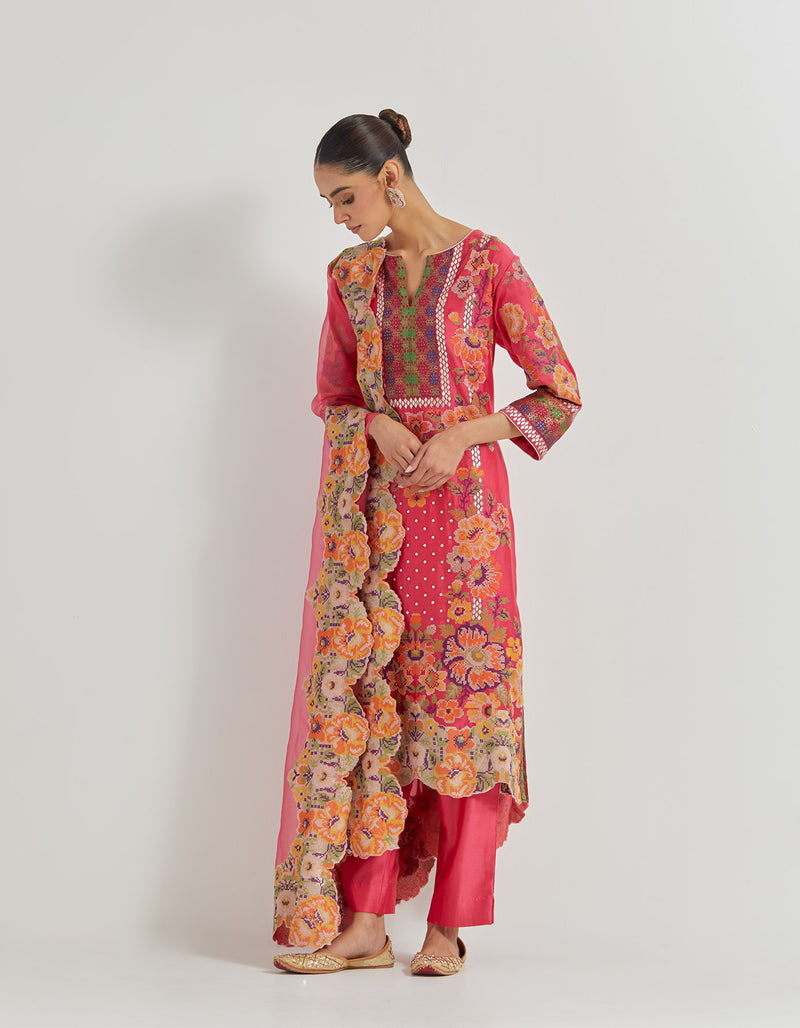 Fuchsia Cross Stitch Embroidered Kurta In Peony Motifs With Silk Brocade Borders Around And Neck And Sleeve Ends Paired With Organza Silk Dupatta