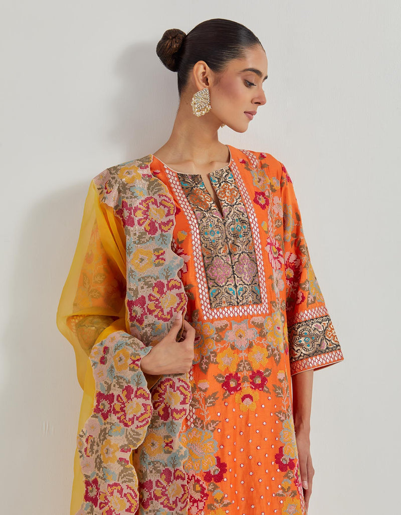 Chanderi Cross Stitch Embroidered Kurta In Peony Motifs With Silk Brocade Borders Around And Neck And Sleeve Ends Paired With Organza Silk Dupatta