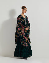 Bottle Green Velveteen Cross Stitch And Hand Embroidred Cape Paired With Pleated Emrboidered Sharara Pants And Bustier