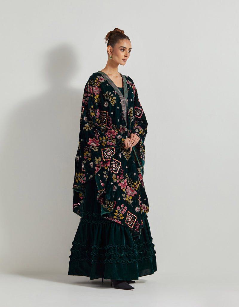 Bottle Green Velveteen Cross Stitch And Hand Embroidred Cape Paired With Pleated Emrboidered Sharara Pants And Bustier