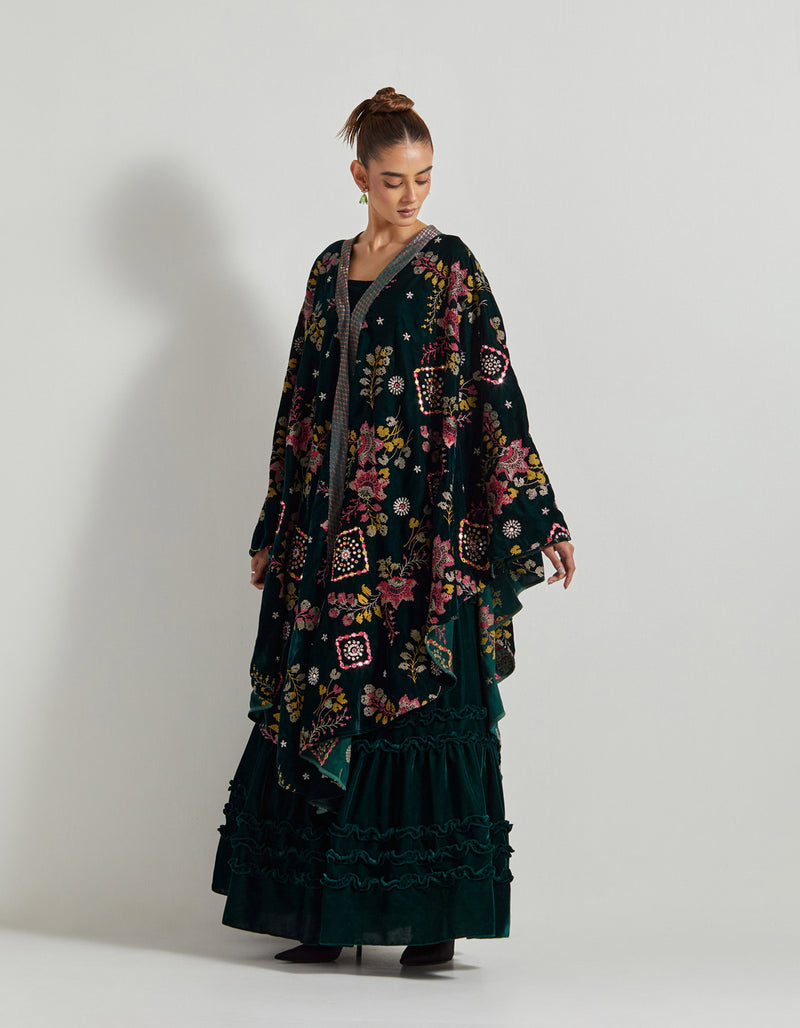 Bottle Green Velveteen Cross Stitch And Hand Embroidred Cape Paired With Pleated Emrboidered Sharara Pants And Bustier