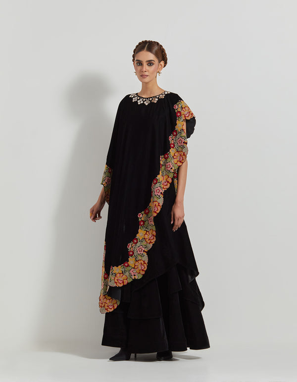 Black Asymetric Velveteen Cape With Neckline Hand Embroidery Paired With Tiered Velveteen Skirt