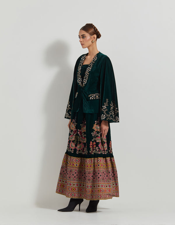 Bottle Green Velveteen Hand Embellished Jacket Paired With Cross Stitch Embroidered Skirt And Bustier