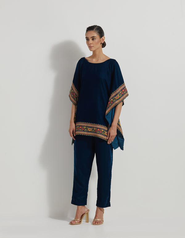 Velveteen Poncho Top With Floral Cross Stitch Borders Paired With Velveteen Straight Pants