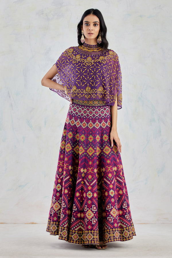 Organza Silk Cape In Colourful Bead Work Embroidery Paired With Dupion Skirt In Intricate Cross Stitch Embroidery